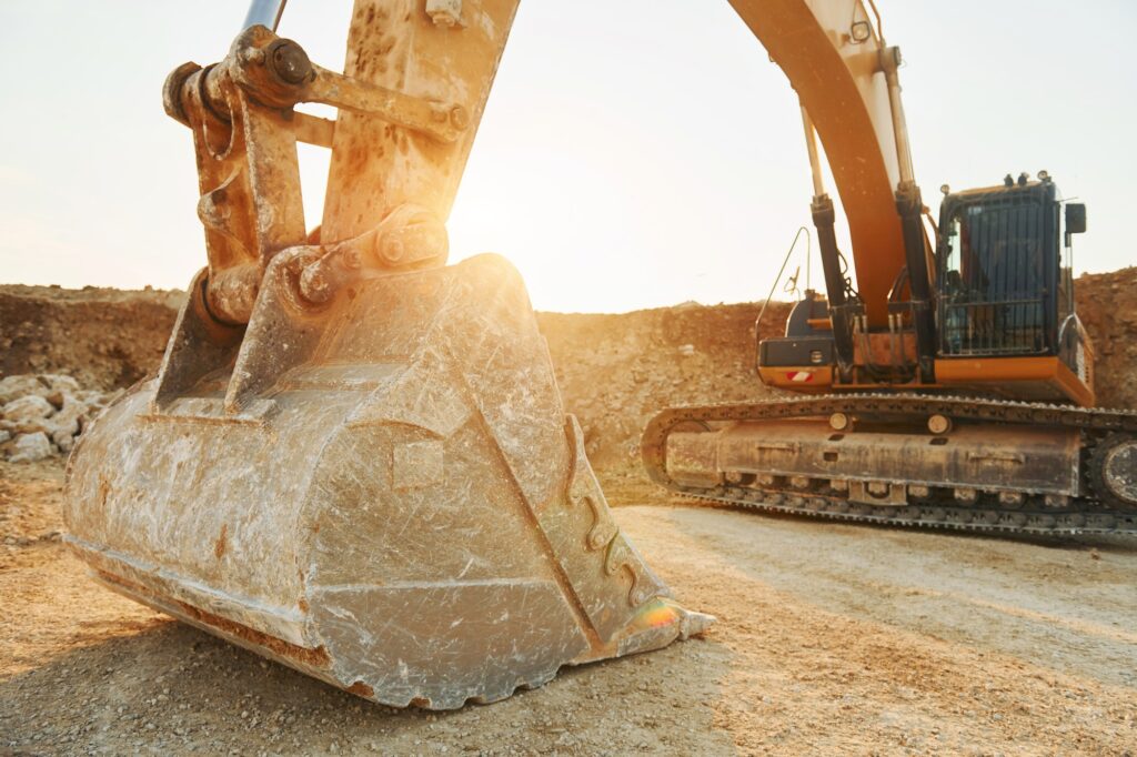 Loading vehicle is outdoors on the borrow pit at daytime