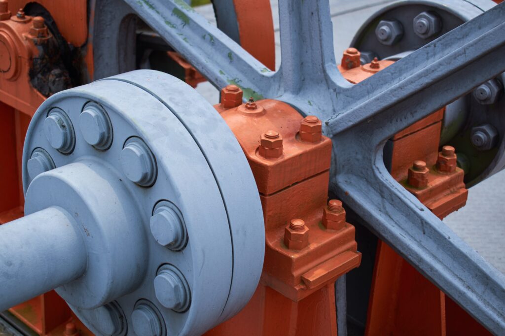 Close-up of a large orange mechanical part