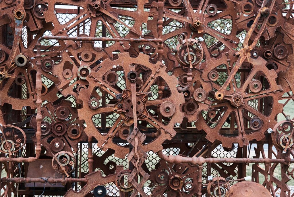 Rusty iron mechanical parts and gear wheels. Steampunk texture