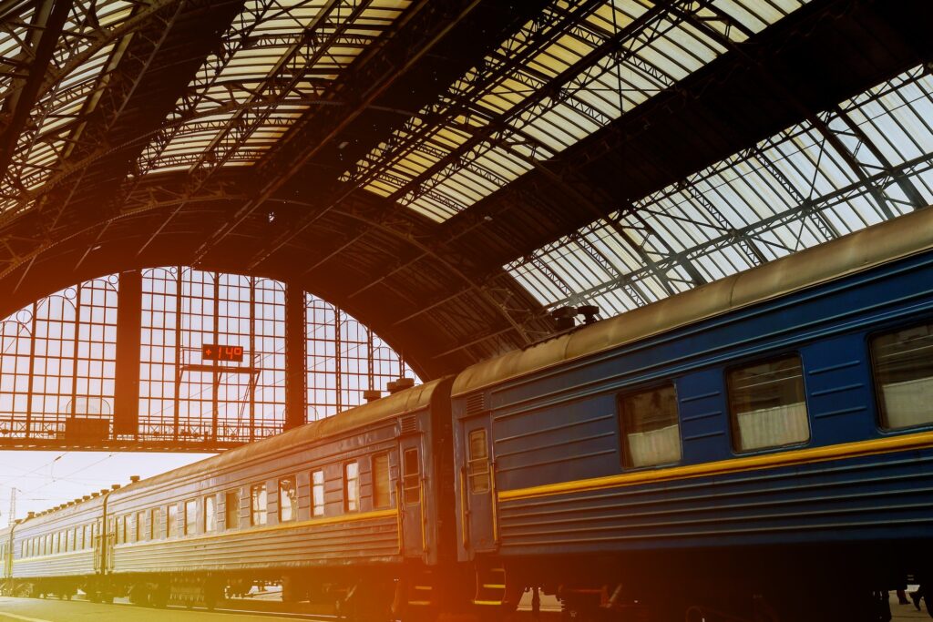 iron arches and empty platform of ancient Lviv Central Station at early morning