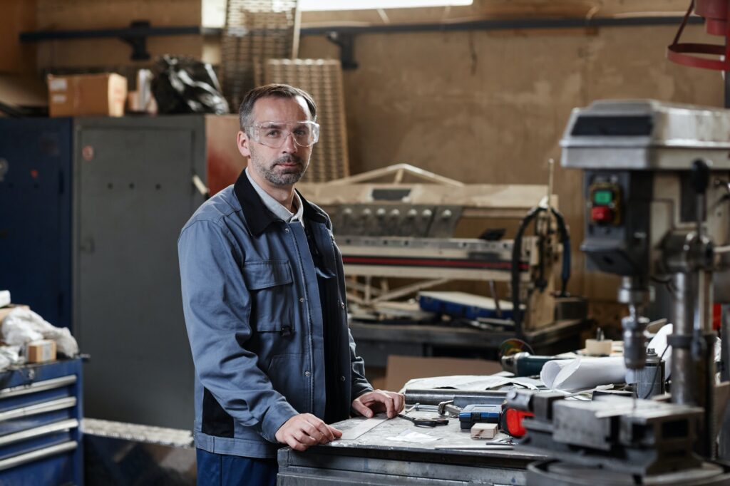 Portrait Of Man At Metalworking Factory