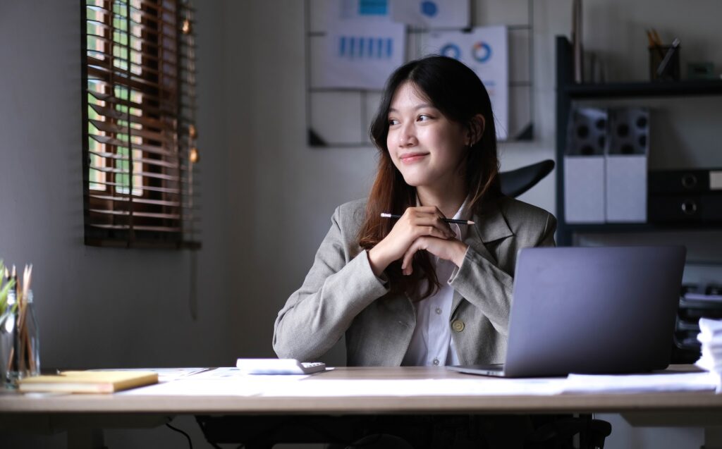 Asian business woman working in office with laptop paper work, Business woman concept.