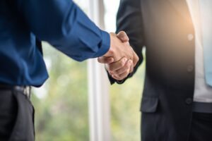 business people join hand together or handshake agreed to as a partner and trust