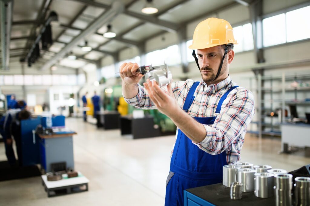 Supervisor doing quality control and pruduction check in factory