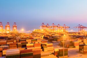 container wharf in nightfall, international import and export trade background